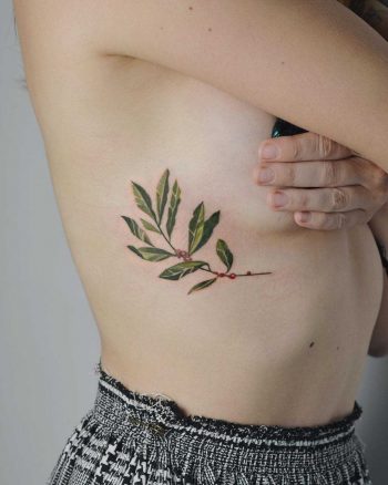 Coffee plant tattoo on the rib