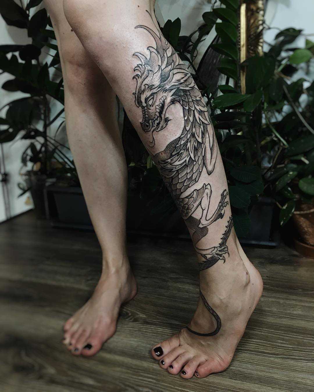 Cool dragon tattoo on the left calf