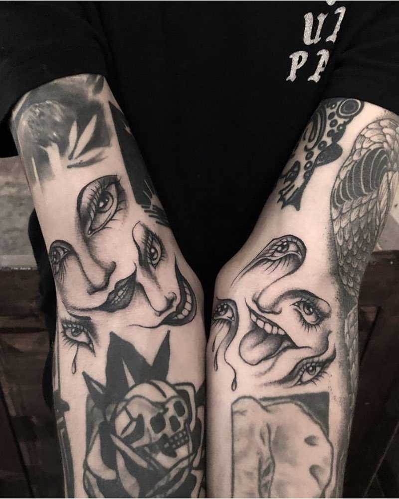 Crazy surrealist faces tattoo by Adam Vunoir