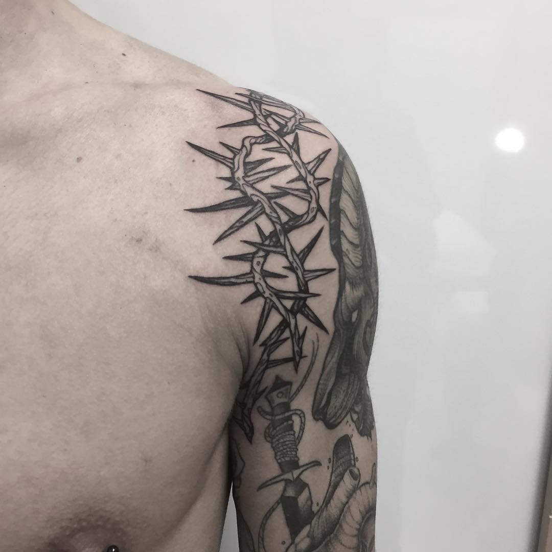 Crown of thorns tattoo on the shoulder
