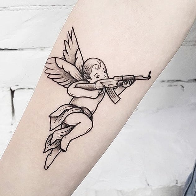 Cupid with an AK-47 by Ink And Water Tattoo
