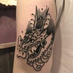 Cute dragon tattoo on the arm