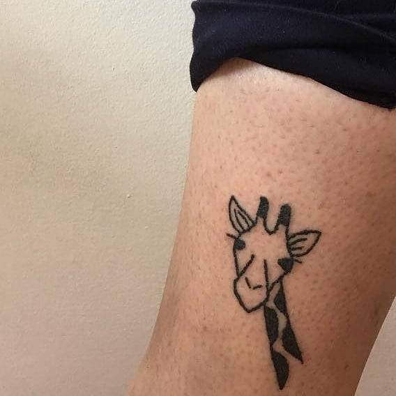 Cute giraffe tattoo