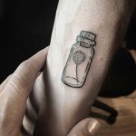 Dandelion in a jar tattoo