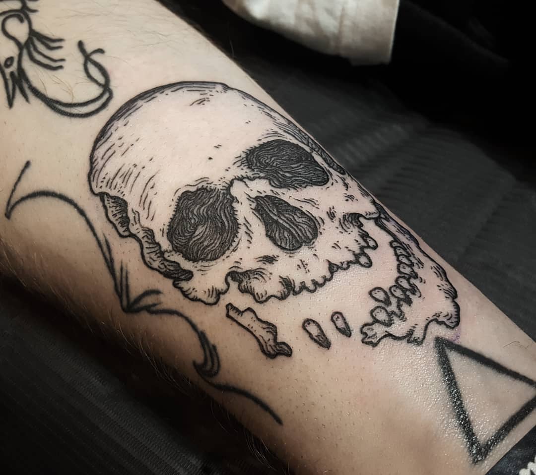Decaying skull tattoo
