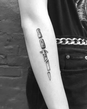 Decomposed switchblade tattoo