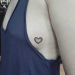 Dot-work heart tattoo on the side
