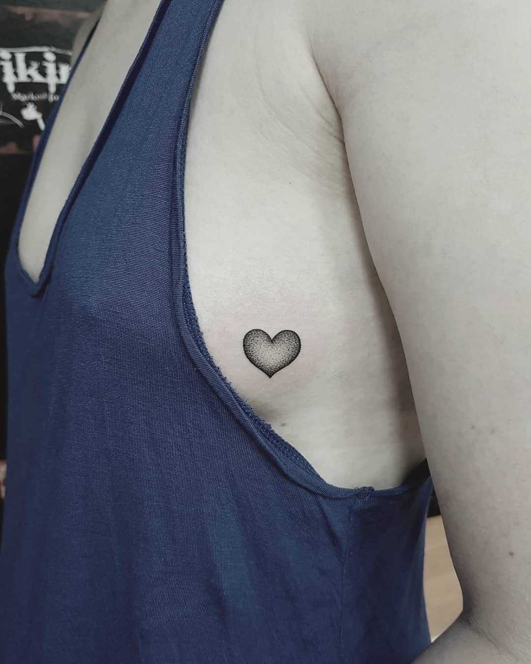 Dot-work heart tattoo on the side