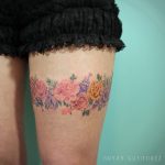 Floral piece on the thigh