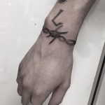 Freehand barbed wire bracelet tattoo