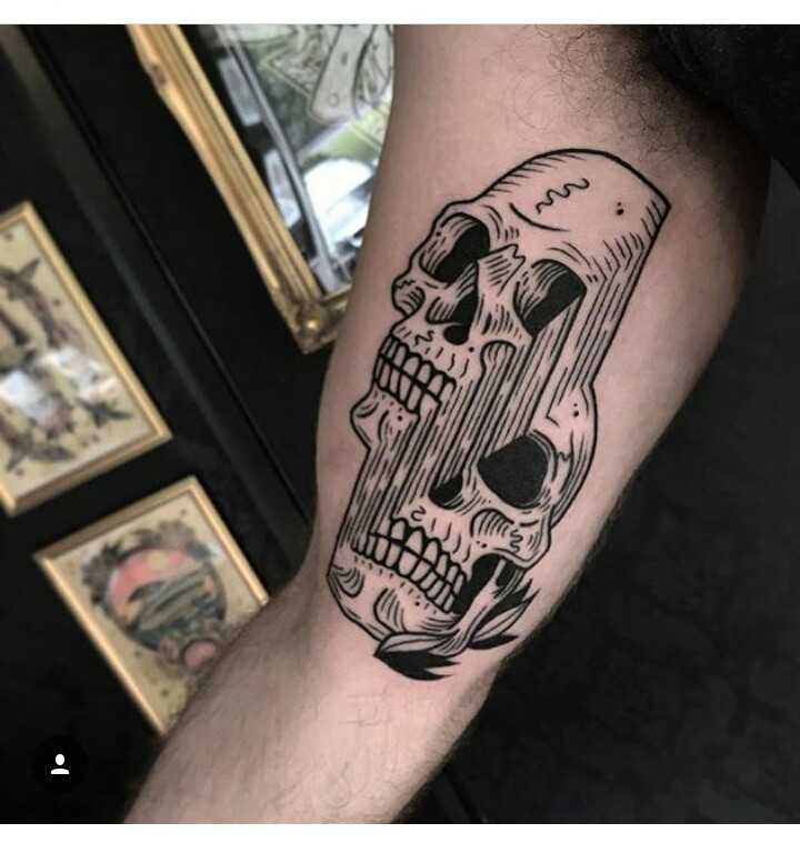 Glitchy skull tattoo