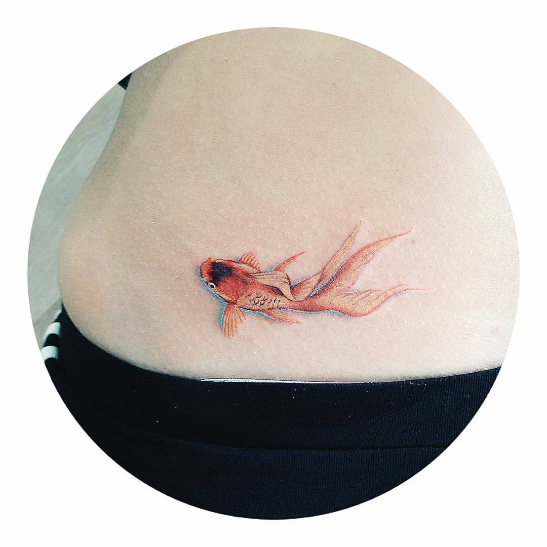 Goldfish tattoo on the back