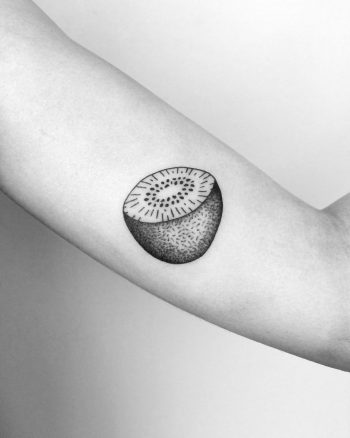 Half kiwifruit tattoo