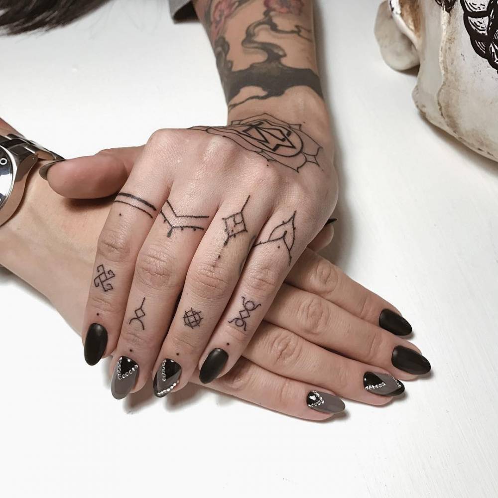 Hand-Poked ornaments on fingers
