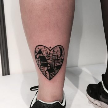 Heart-shaped city landscape tattoo