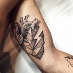 Heart tattoo on the bicep by Sasha Tattooing