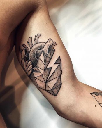 Heart tattoo on the bicep by Sasha Tattooing