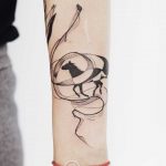 Horse and abstract lines tattoo