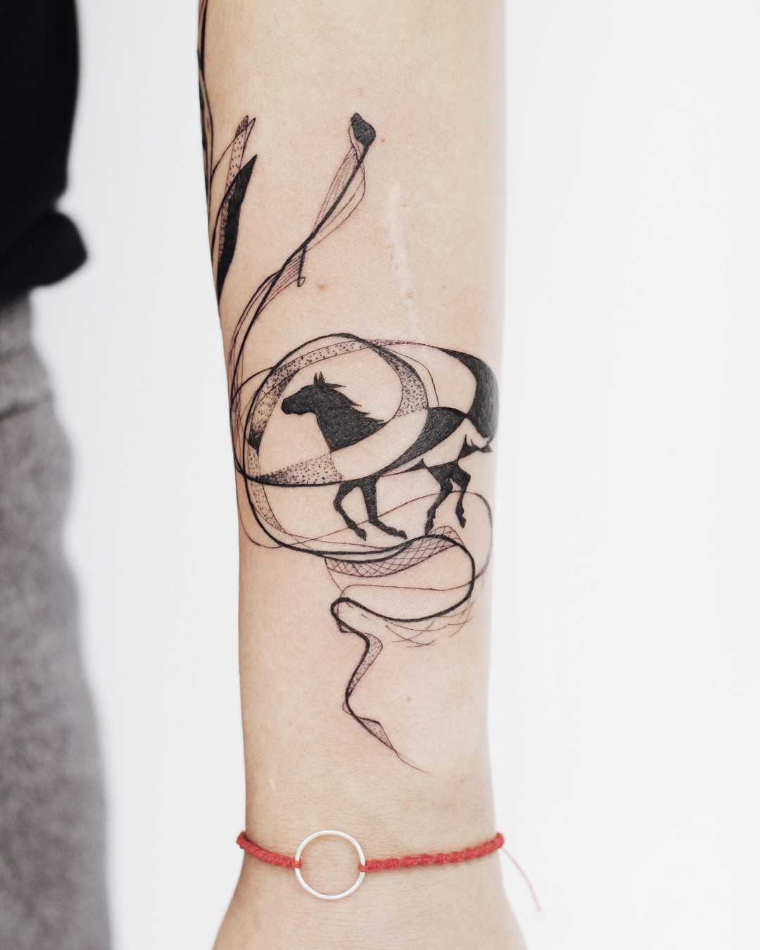 Horse and abstract lines tattoo