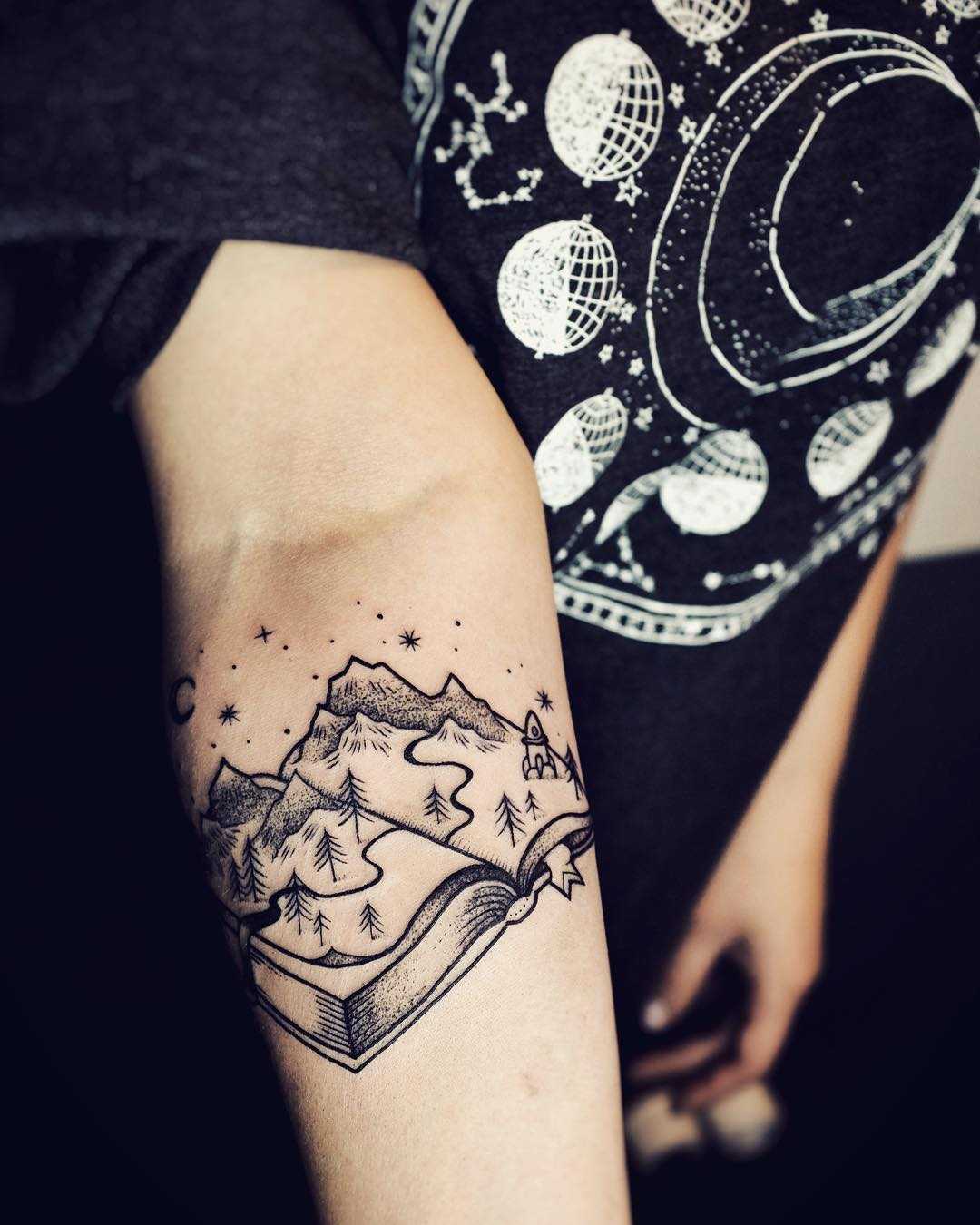 Landscape book tattoo by Sasha Tattooing
