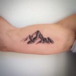 Little dot-work mountain tattoo