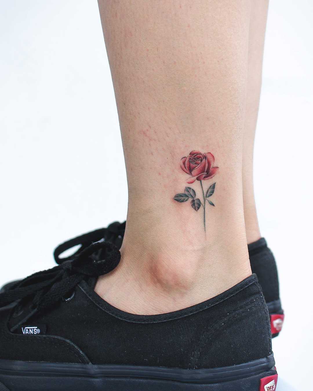 Little red rose tattoo on the left ankle