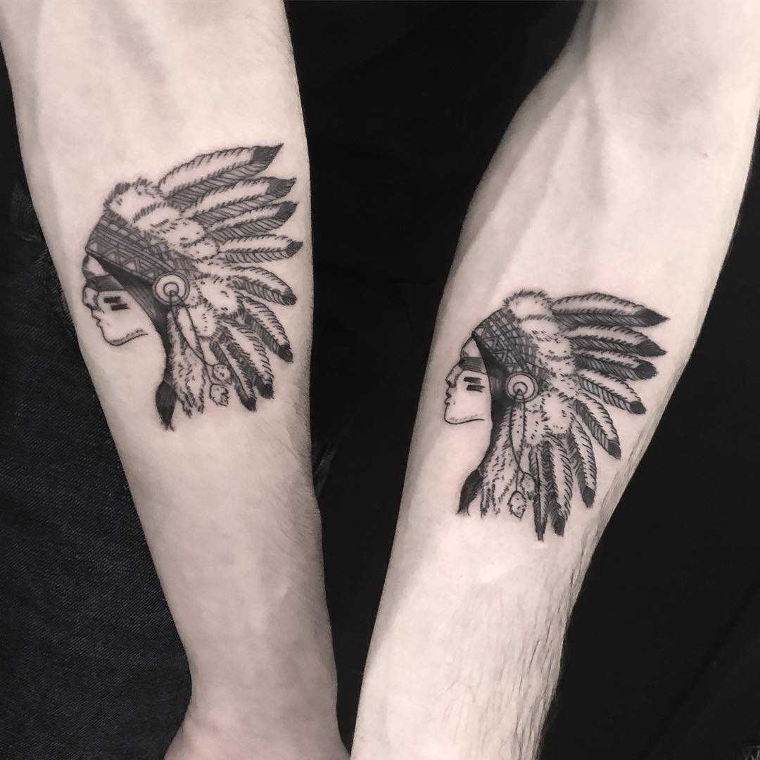 Matching Native American tattoos for brothers