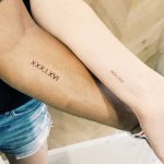 Matching date tattoos for a couple by Cholo