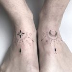 Matching moon and sun tattoos on both feet