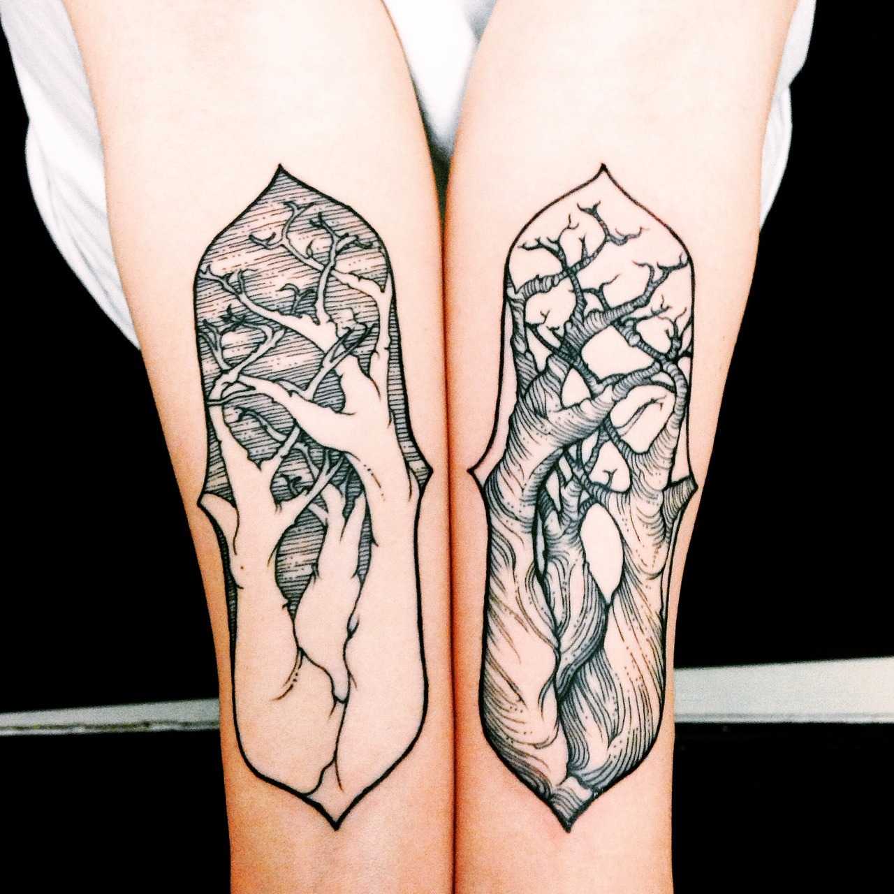 Matching three tree tattoos