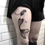 Mermaid tattoo on the thigh