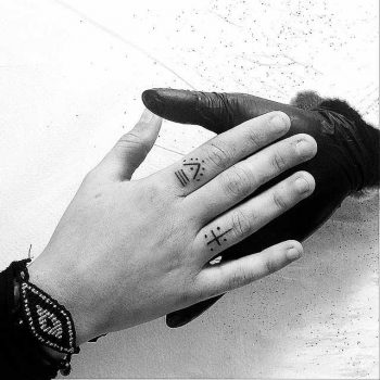 Minimal line tattoos on fingers
