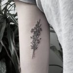 Minimalist floral bouquet tattoo
