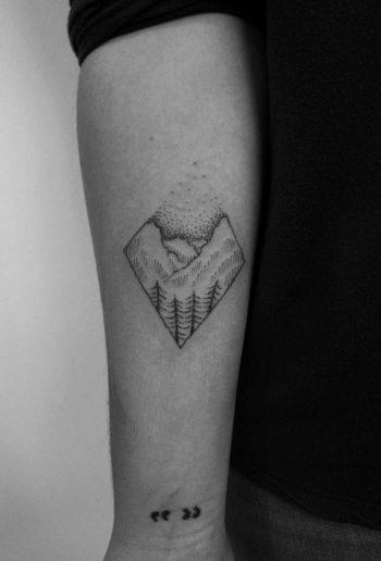 Minimalist mountain scene tattoo by Regius Ink