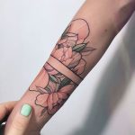 Negative space armband and flowers tattoo