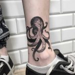 Octopus tattoo on the left shin