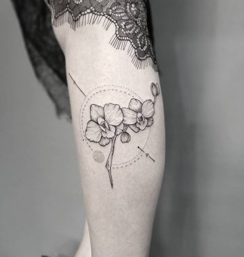 Orchids tattoo on the calf