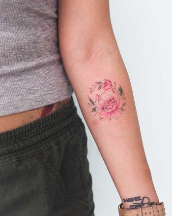 Peony tattoo on the left forearm