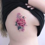 Peony tattoo on the rib cage by Iris Tattoo Art
