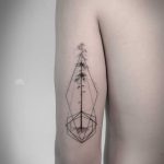 Pine tree and geometric shapes tattoo