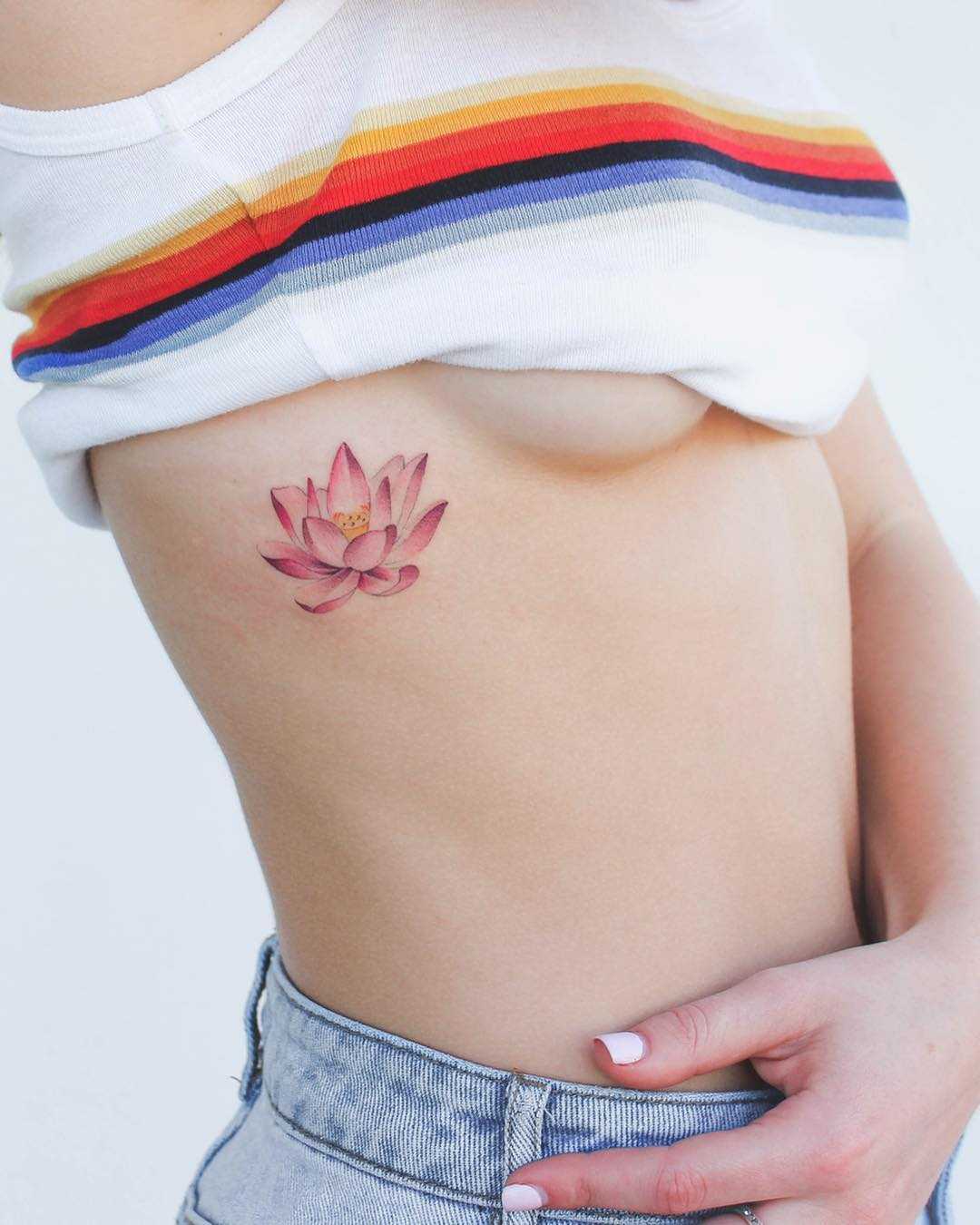 Pink Lotus tattoo on the rib cage