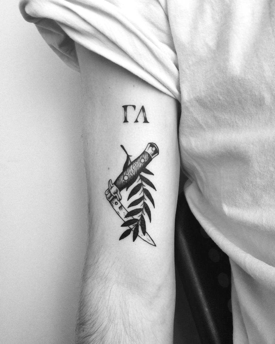 Pocket knife and branch tattoo