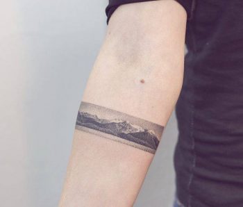 Realistic mountain landscape armband tattoo