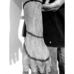 Rope tattoo around the hand