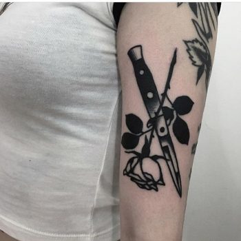 Rose and switchblade tattoo by Ignacio TTD