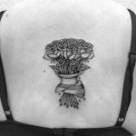 Rose bouquet tattoo on the back