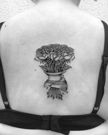 Rose bouquet tattoo on the back