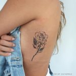 Rose tattoo on the rib cage by Bryan Gutierrez
