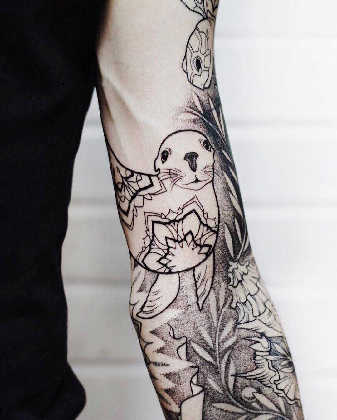 Seal and mandala tattoo