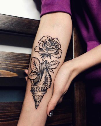 Shell and rose tattoo